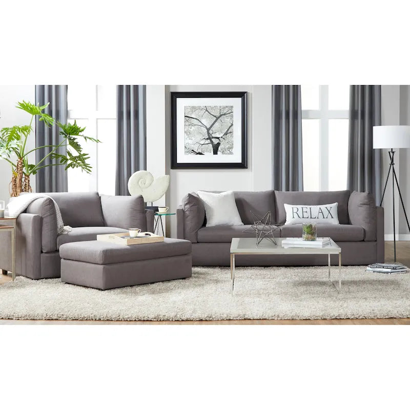 Ensemble canapé trois places et fauteuil en tissu avec coussins et dossiers