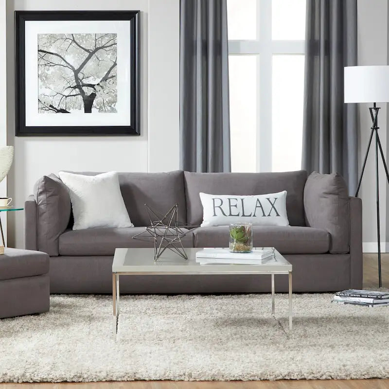 Ensemble canapé trois places et fauteuil en tissu avec coussins et dossiers