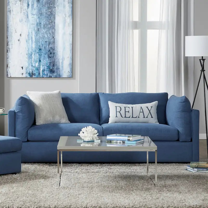 Ensemble canapé trois places et fauteuil en tissu avec coussins et dossiers