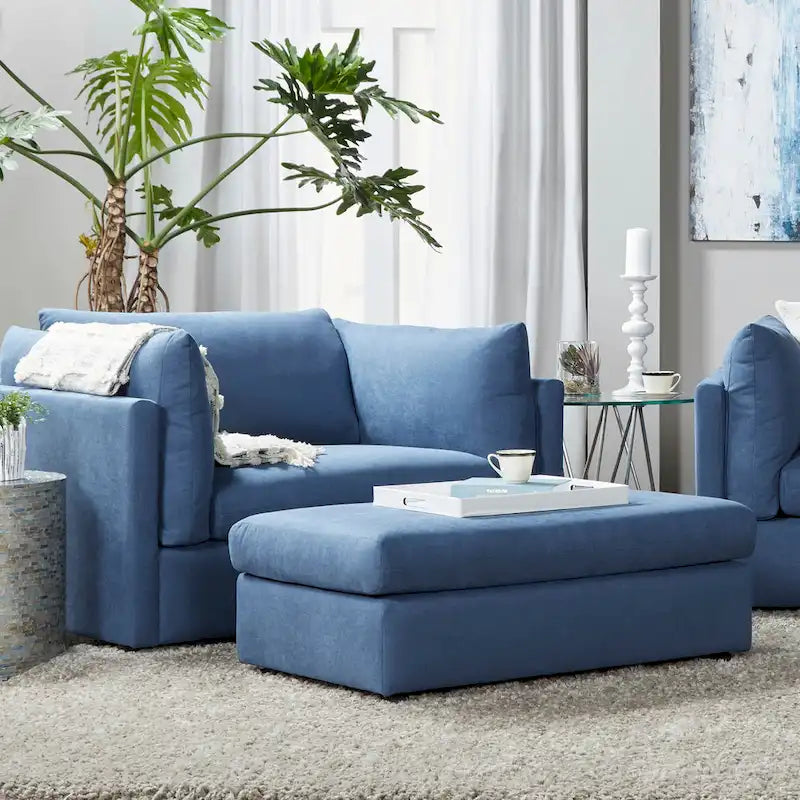 Ensemble canapé trois places et fauteuil en tissu avec coussins et dossiers